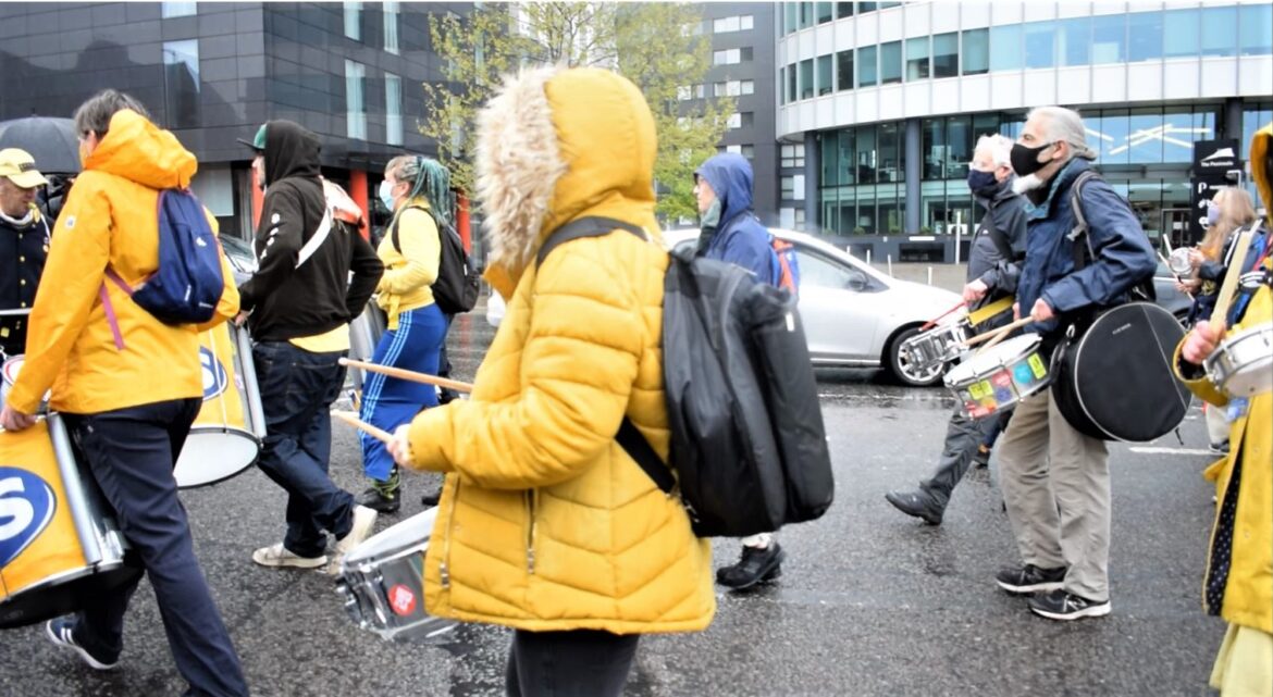 PCS union drummers march to support the striking bus drivers
